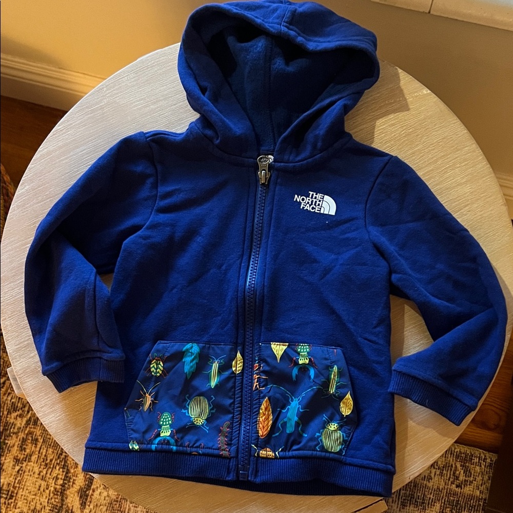 The North Face Kids Royal Blue Zip Hoodie with Printed Pocket Detail